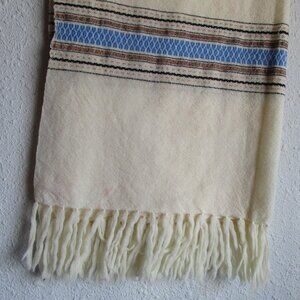Off-white wool shawl with South American geometric design and fringe.